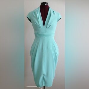 Deep V-neckline cap sleeve draped sheath dress
